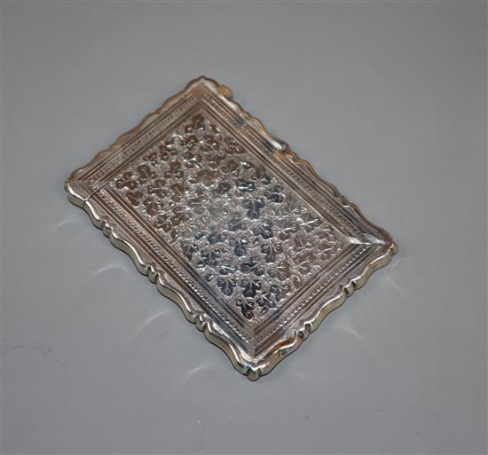 A Victorian engraved silver card case by George Unite, Birmingham, 1876, 96mm.